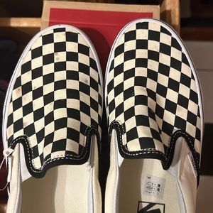 Vans checkered shoes. Slightly worn. Slight spots on top canvas.